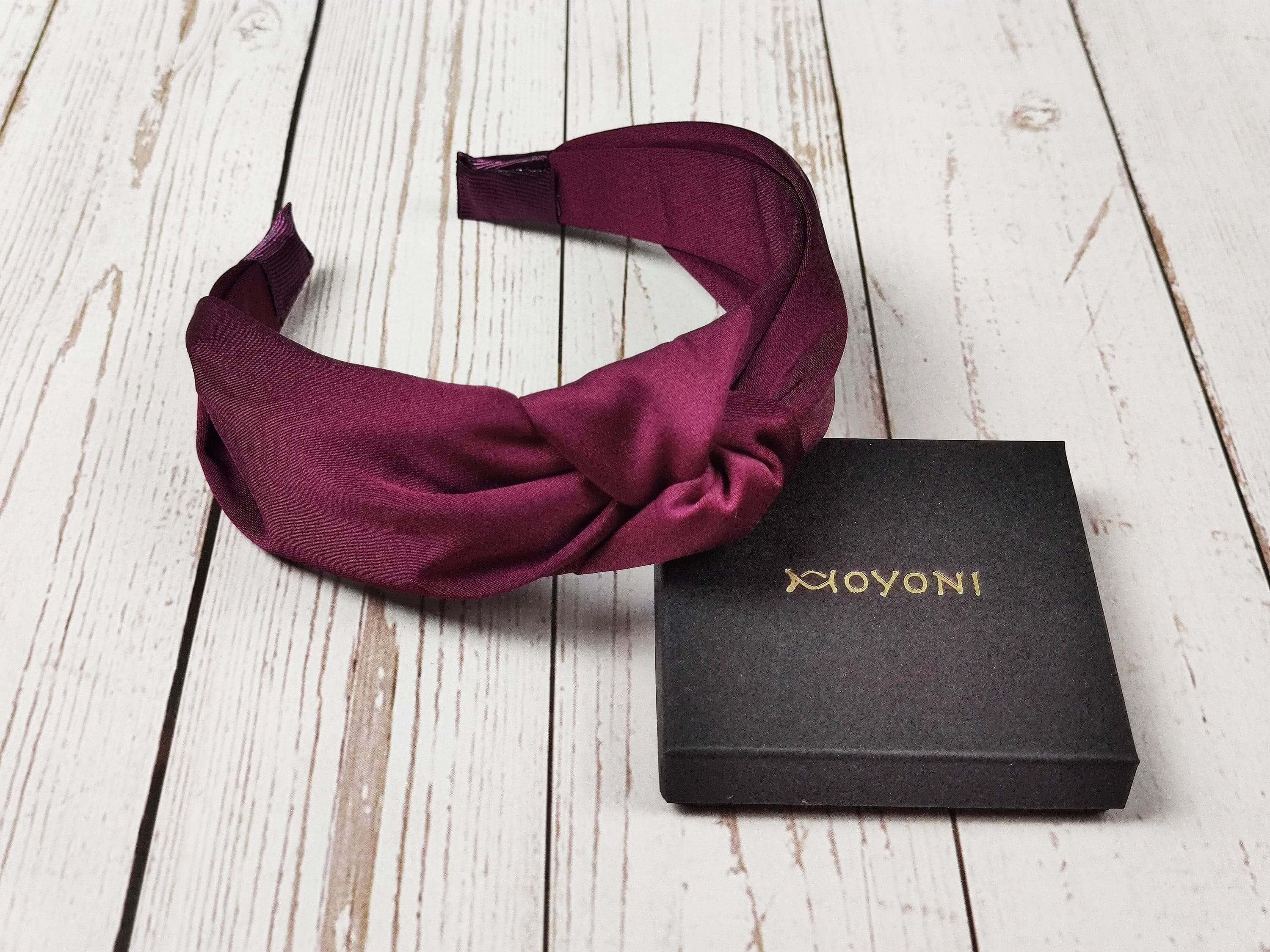 Make a statement with this dark cherry maroon color satin headband, featuring a chic knotted design.