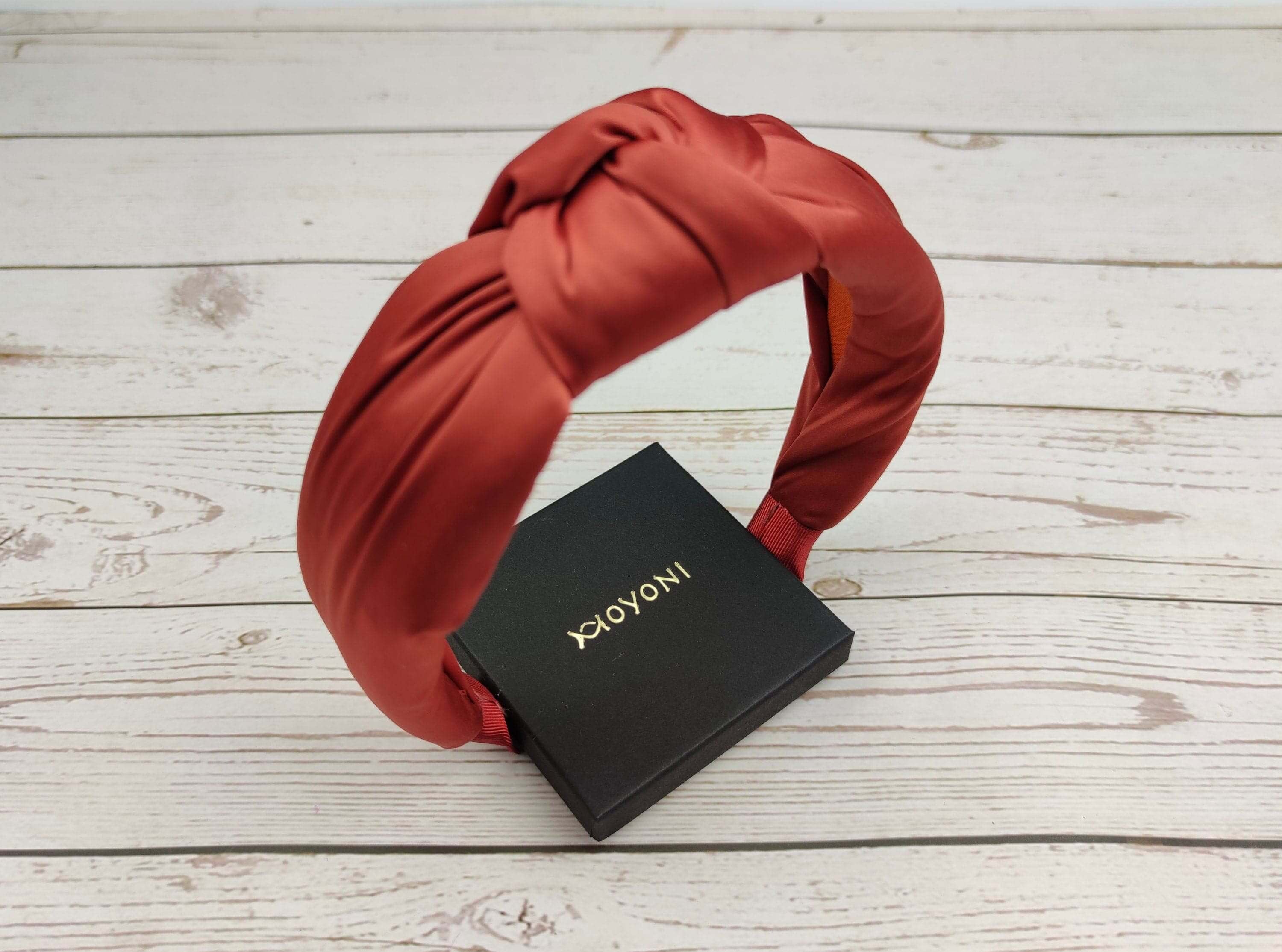Looking for a stylish and affordable summer headband? Look no further than the Cinnamon Color Satin KNOTTED HEADBAND! This versatile headband is perfect for any woman&#39;s wardrobe.