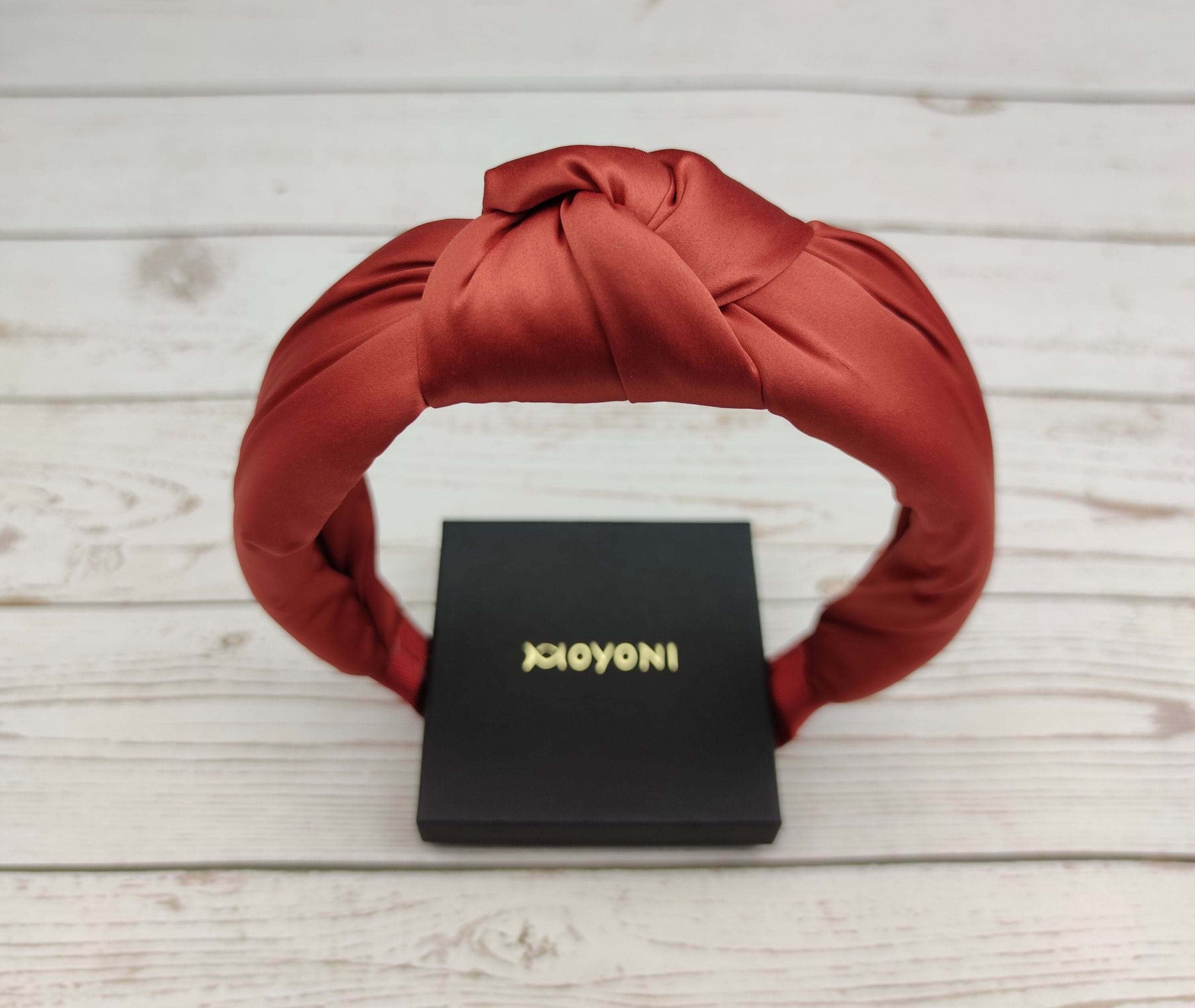 Get ready to be stylish! This Brown Color Padded Satin Headband is perfect for a night out or a day at work. It has a beautiful design and is made from high-quality materials.