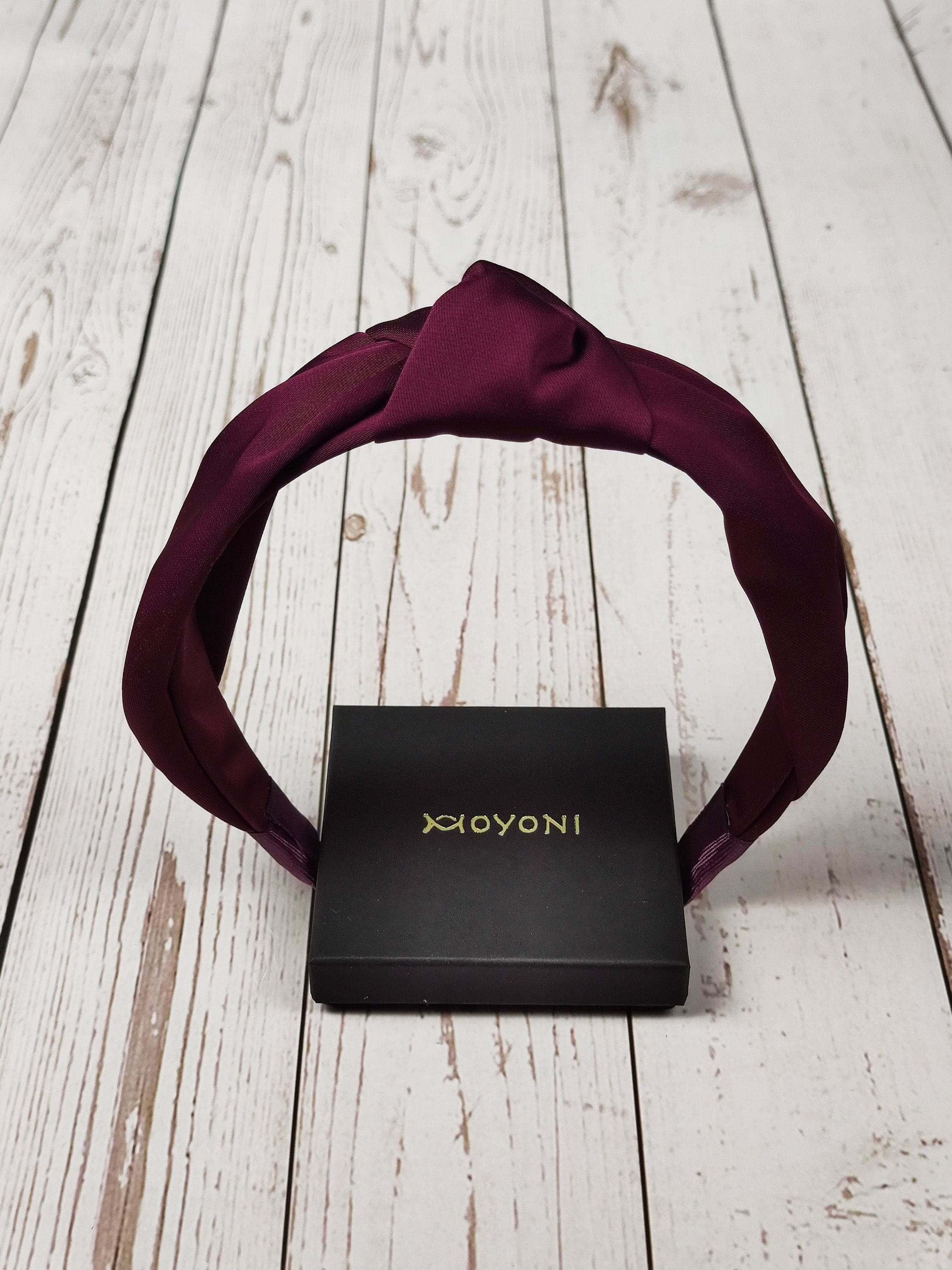 Add a pop of color to your hairstyle with this dark cherry maroon satin headband, without the added bulk of padding.
