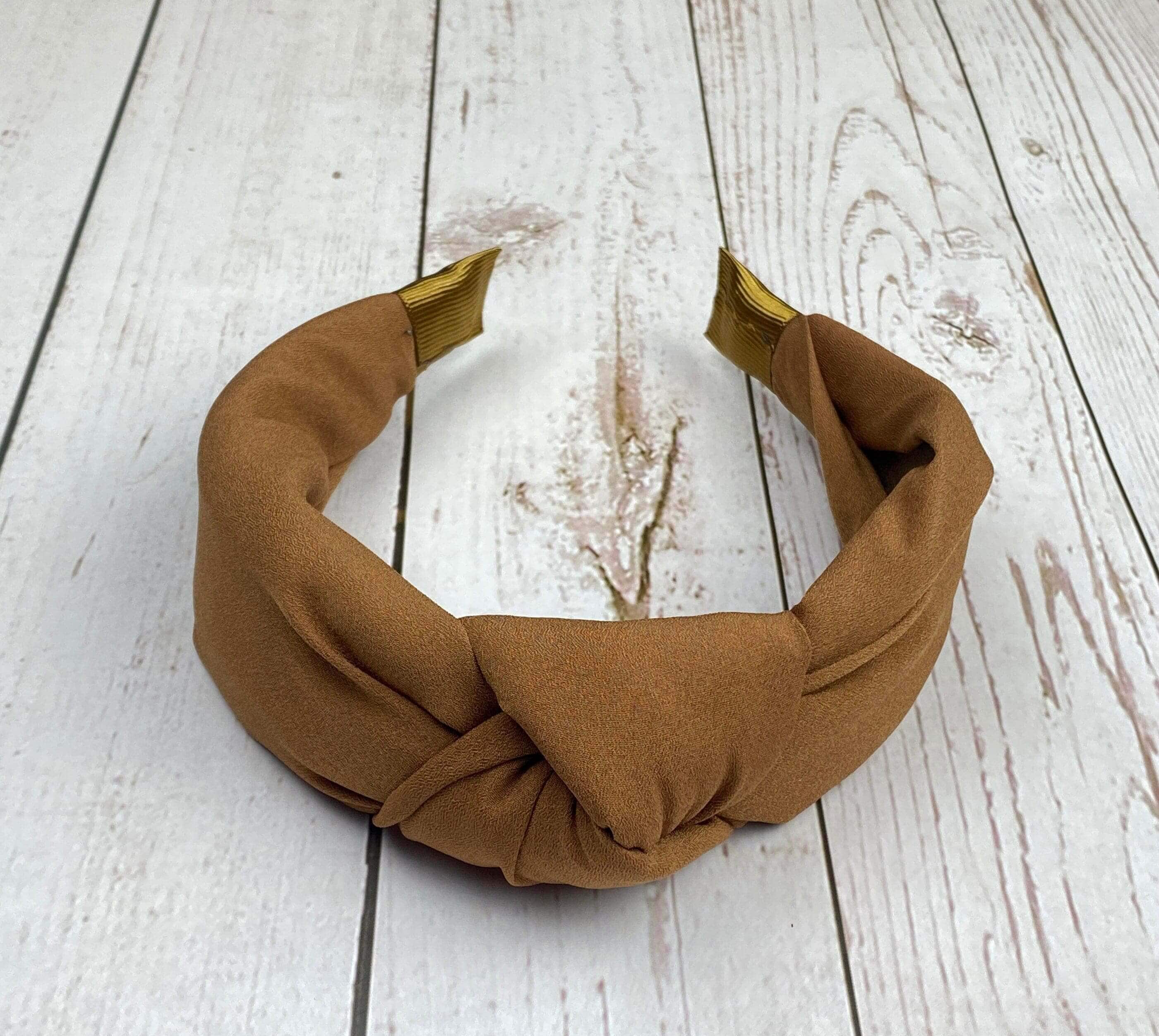 Add a touch of sweetness to your style with Knotted Women Fashionable Headband! Made from soft, light, and comfortable viscose crepe, this headband will keep your hair looking its best all day long.