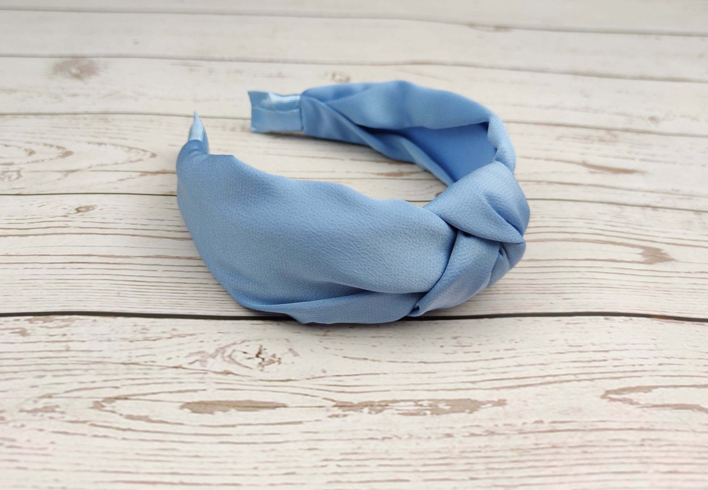 Add some glamour to your outfit with these light blue handmade headbands. From top knot headbands to cloud blue handmade headbands, these will add pizzazz to any outfit you put on!