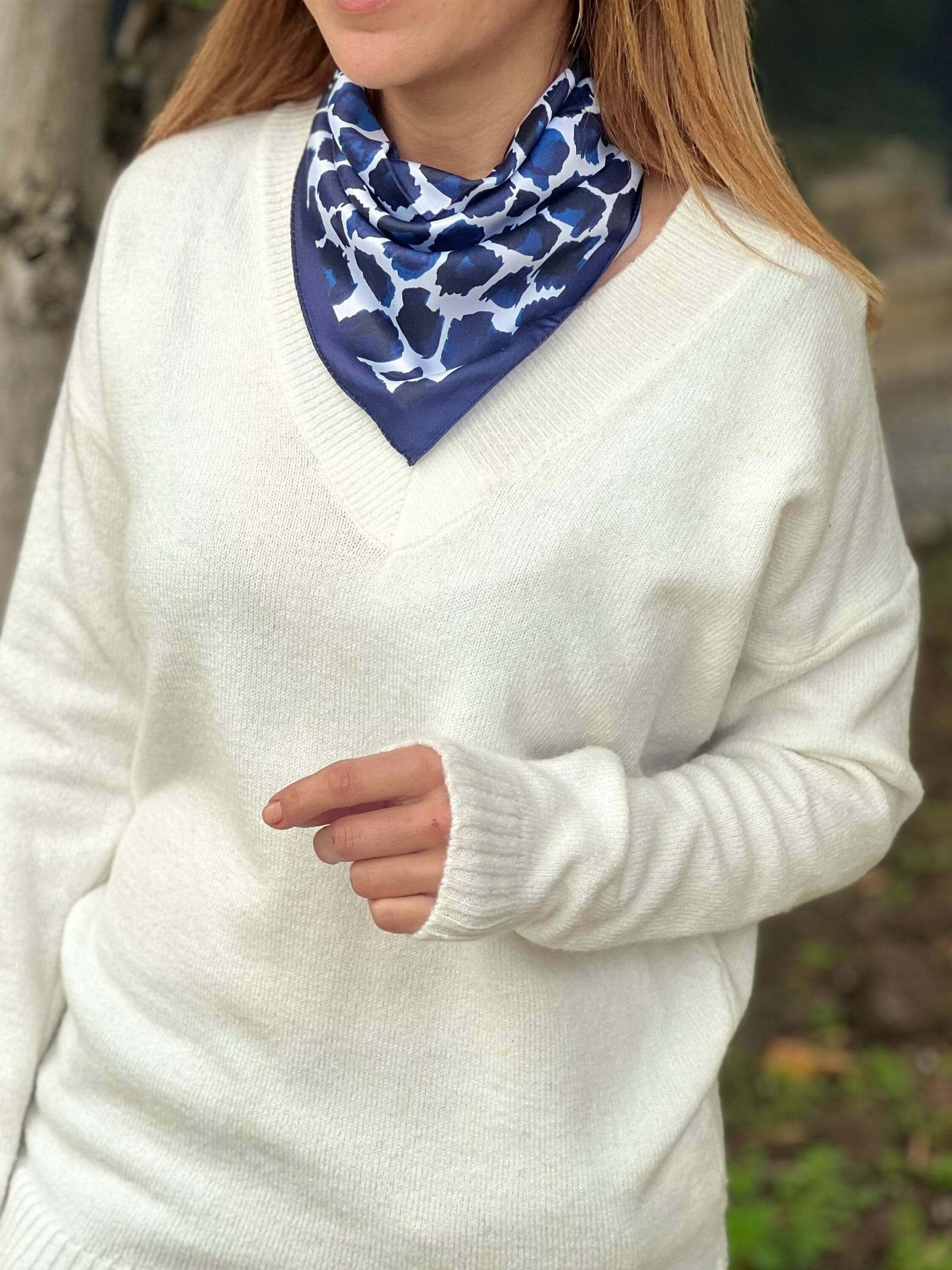 Stay on-trend with this must-have satin scarf, featuring a bold blue leopard pattern and versatile design.