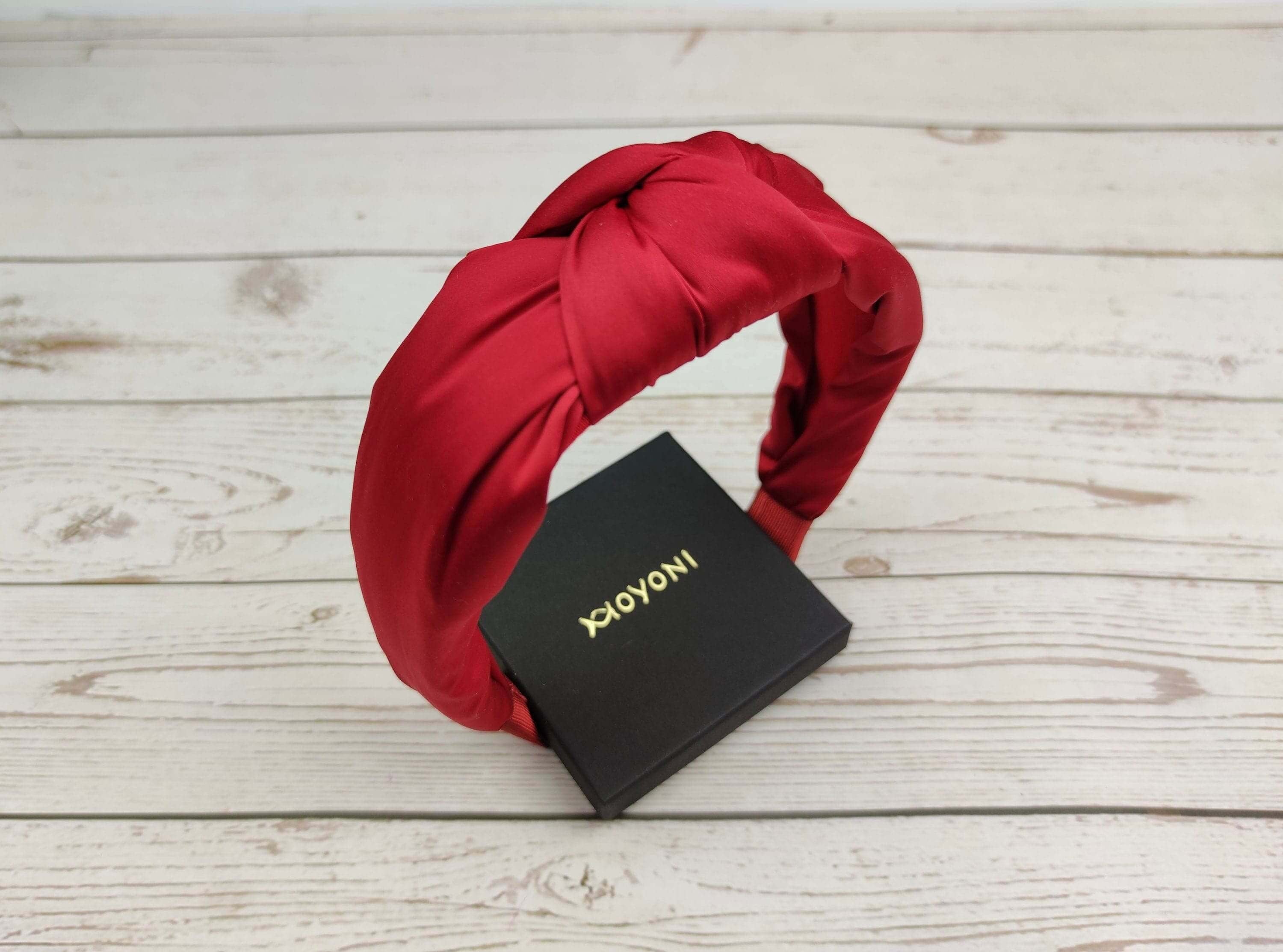Add a pop of color to your sweetheart hairstyle with this gorgeous red satin headband.