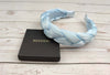Stay stylish with this baby blue satin braided headband.