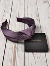 Add a touch of luxury to any outfit with this feminine and stylish knot headband. Made from light purple satin fabric, this headband is perfect for special occasions or days when you want to look your best.