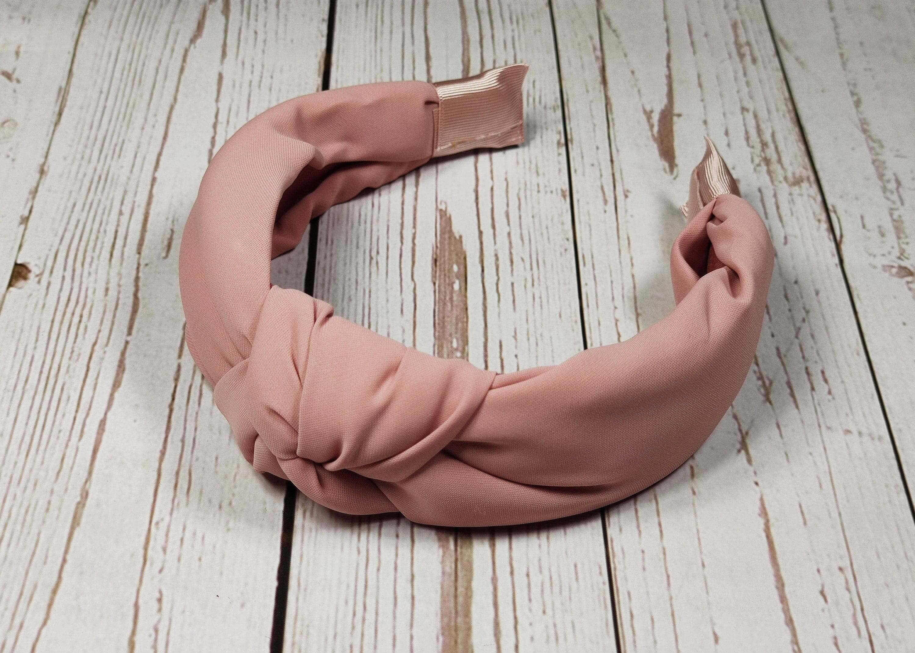 Steal the show this season with Salmon Pink Color Headband! This classy headband is perfect for a sophisticated and elegant look.