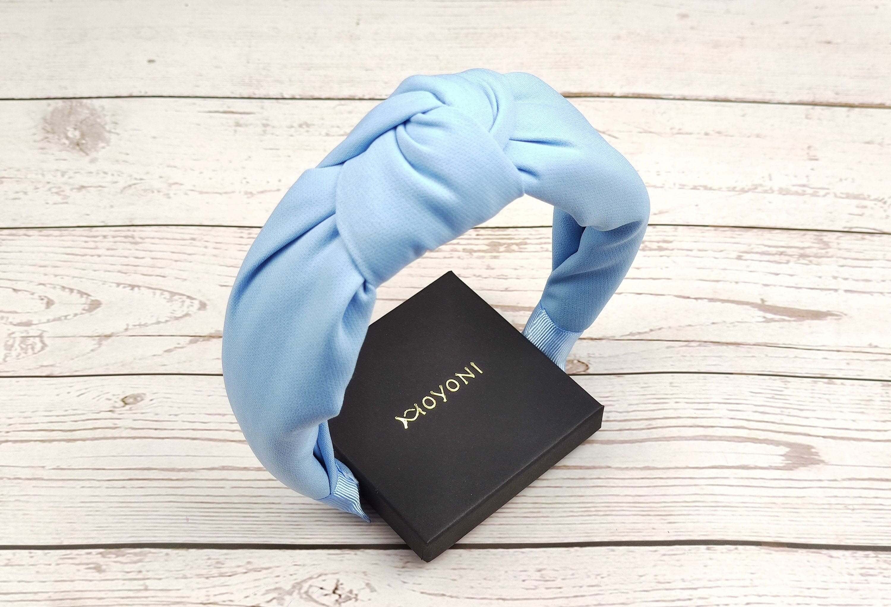 Make a statement with this fashionable and versatile light blue headband for women.