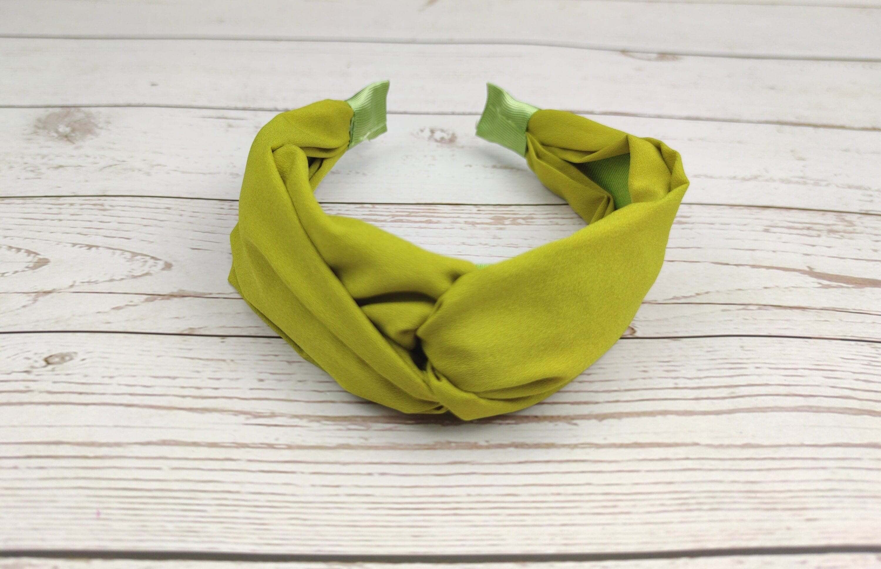 Love making your own accessories? Take a look at the Handmade Headband by Green Headband Studio. This headband is made from 100% cotton yarn and features an easy-to-