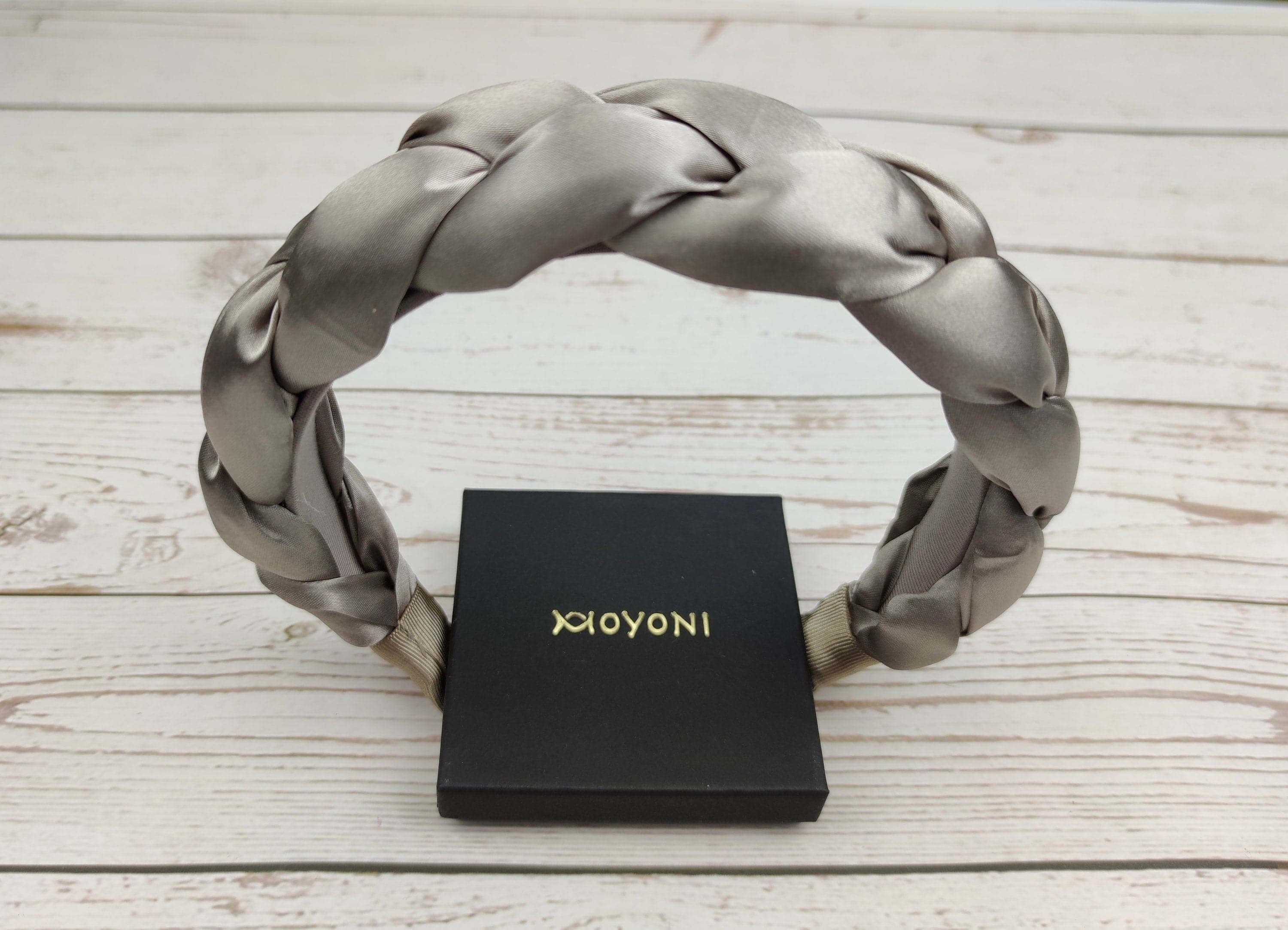 Light up your fashion style with these beige satin headbands. Made from soft and luxurious satin material, these headbands are sure to make a statement. Add a little luxury to any outfit with this stylish headband.