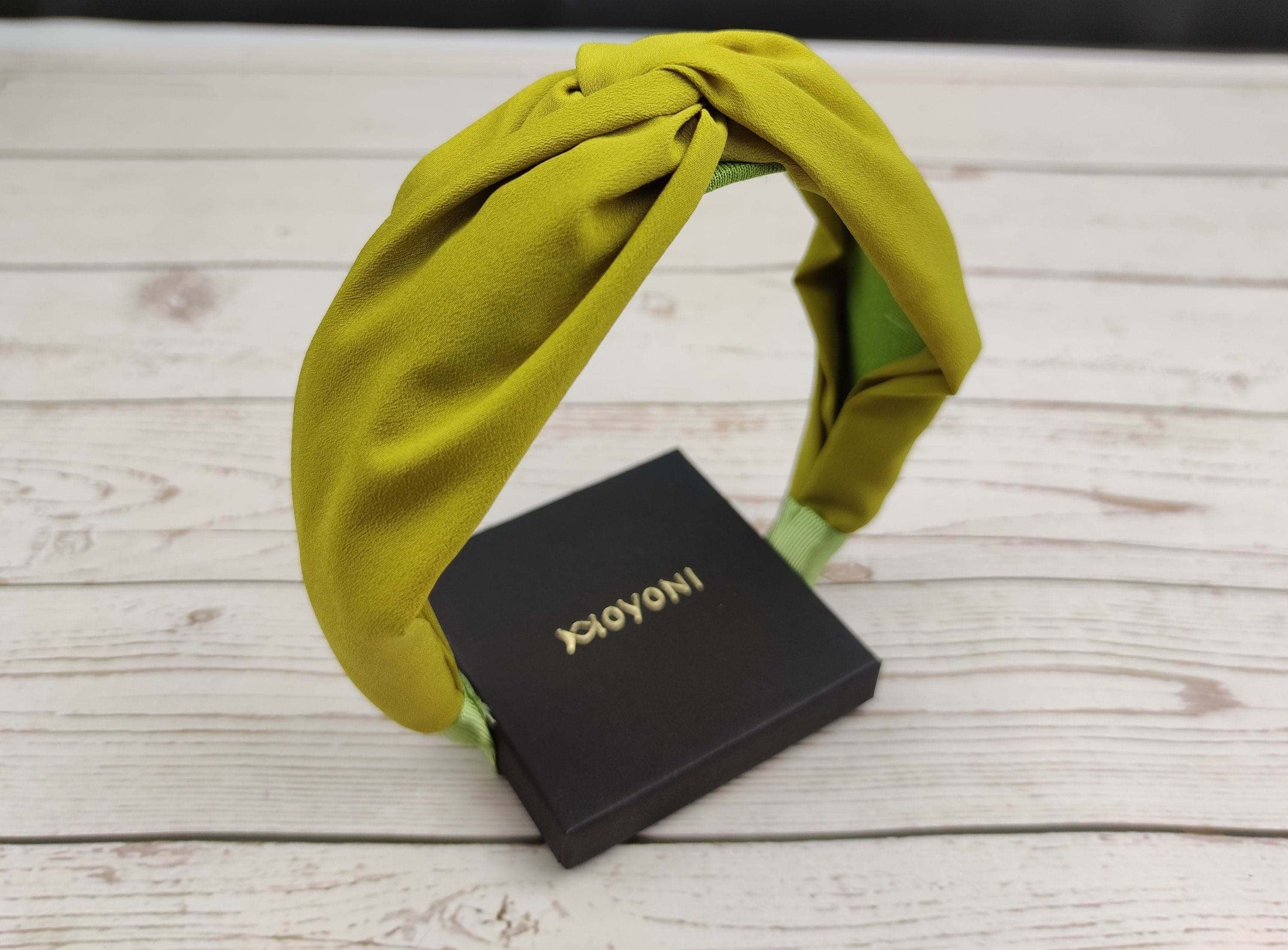 Want to add a little bit of personality to your outfit? Try out the wide headband by Green Headband Studio. This headband is designed to fit most head sizes and comes in a variety of colors and styles.