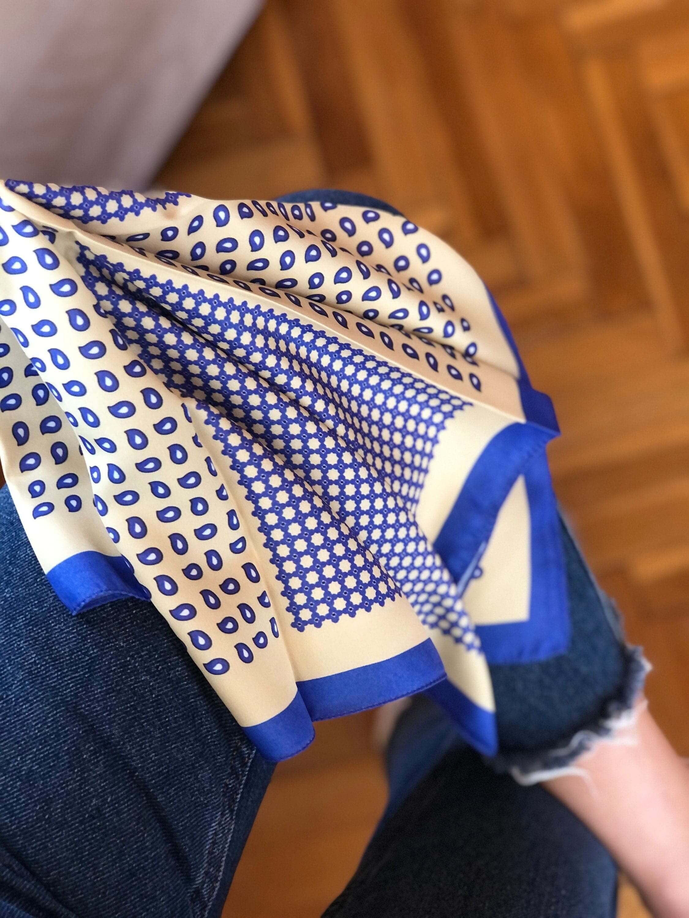 Stay stylish and comfortable with this navy blue and yellow satin scarf. The soft satin material makes it perfect for wearing as a head scarf or neck scarf, adding a touch of sophistication to any outfit.