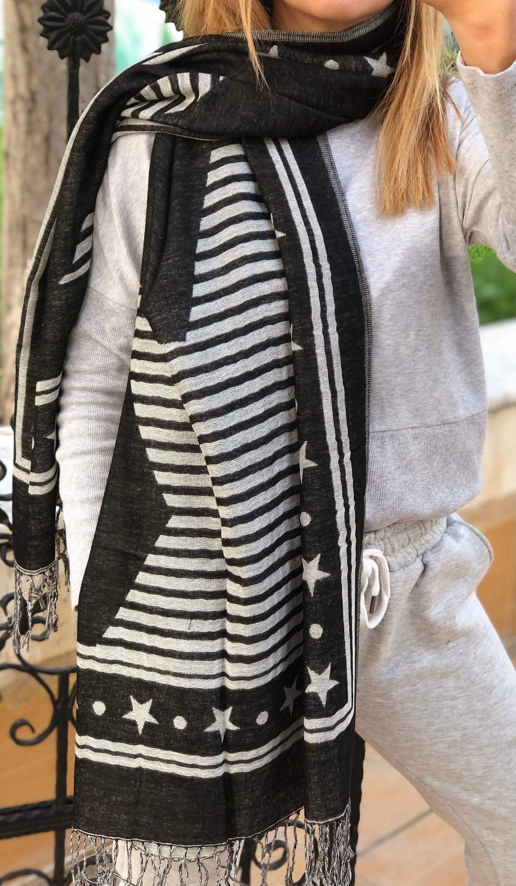 Starry Night Cotton Scarf: A beautiful cotton scarf featuring a starry night pattern in shades of black and white. Perfect for adding a touch of glamour and sophistication to any outfit.