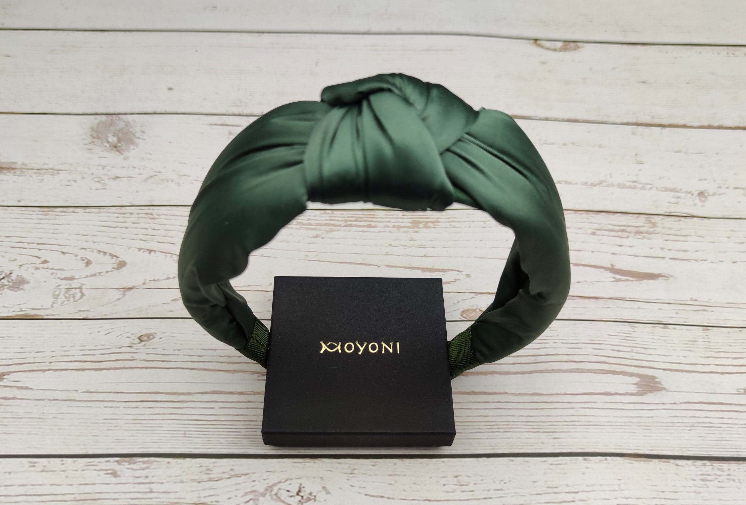 Find the best Green color padded satin headband here! This stylish headband is made of satin fabric and features a twisted design, making it extra comfortable to wear.
