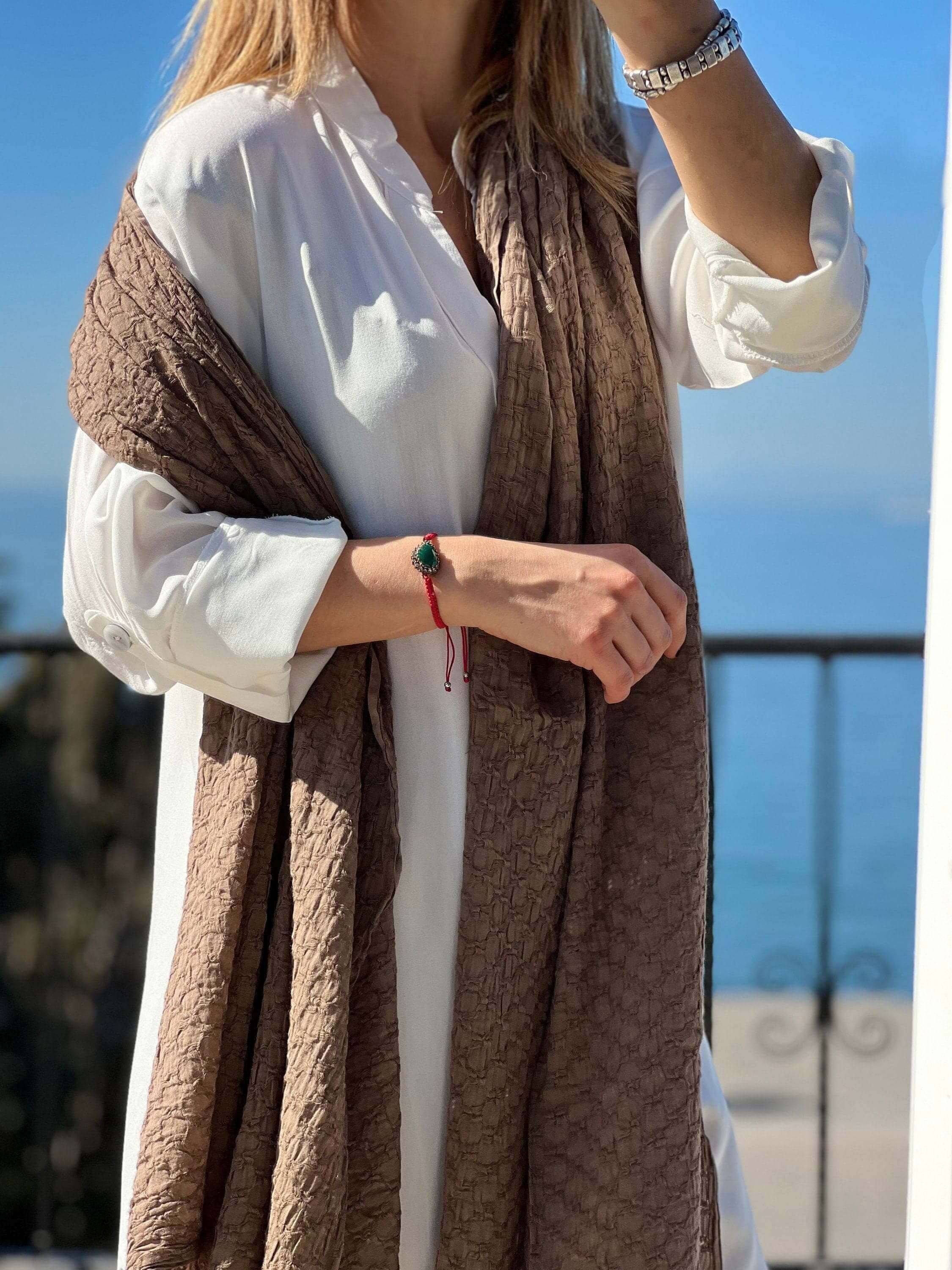 Get your mom the perfect gift this winter with an organic cotton large rectangle scarf in mink color. This scarf is perfect for all seasons and will keep her warm and cozy.