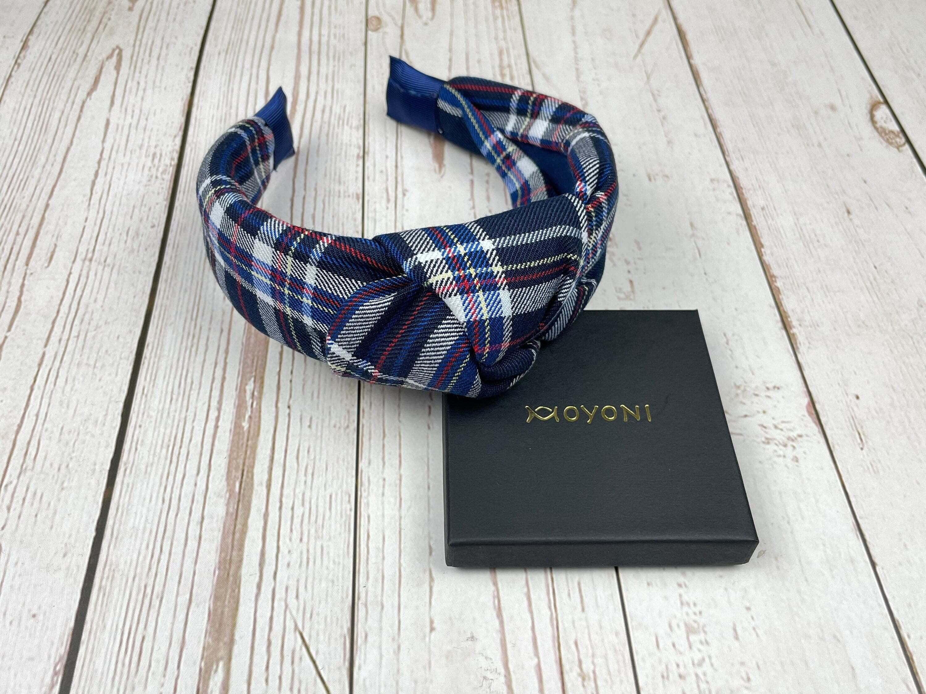 Add a touch of style to your ensemble with this blue plaid pattern headband. It is sure to compliment any outfit and look great with any hairstyle.