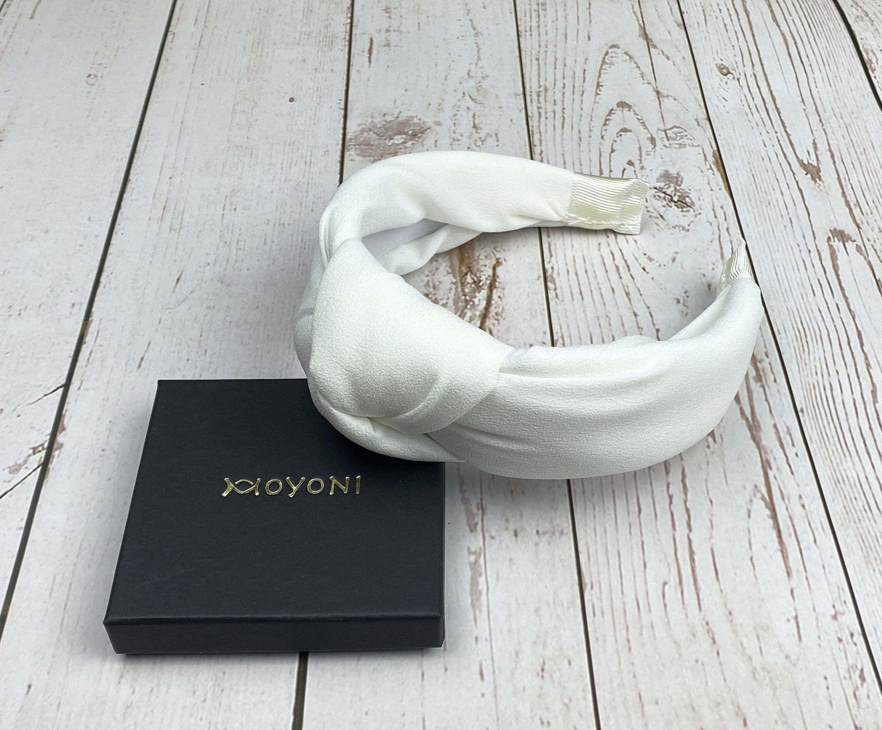 Luxurious snow-white padded headband for weddings and special celebrations.