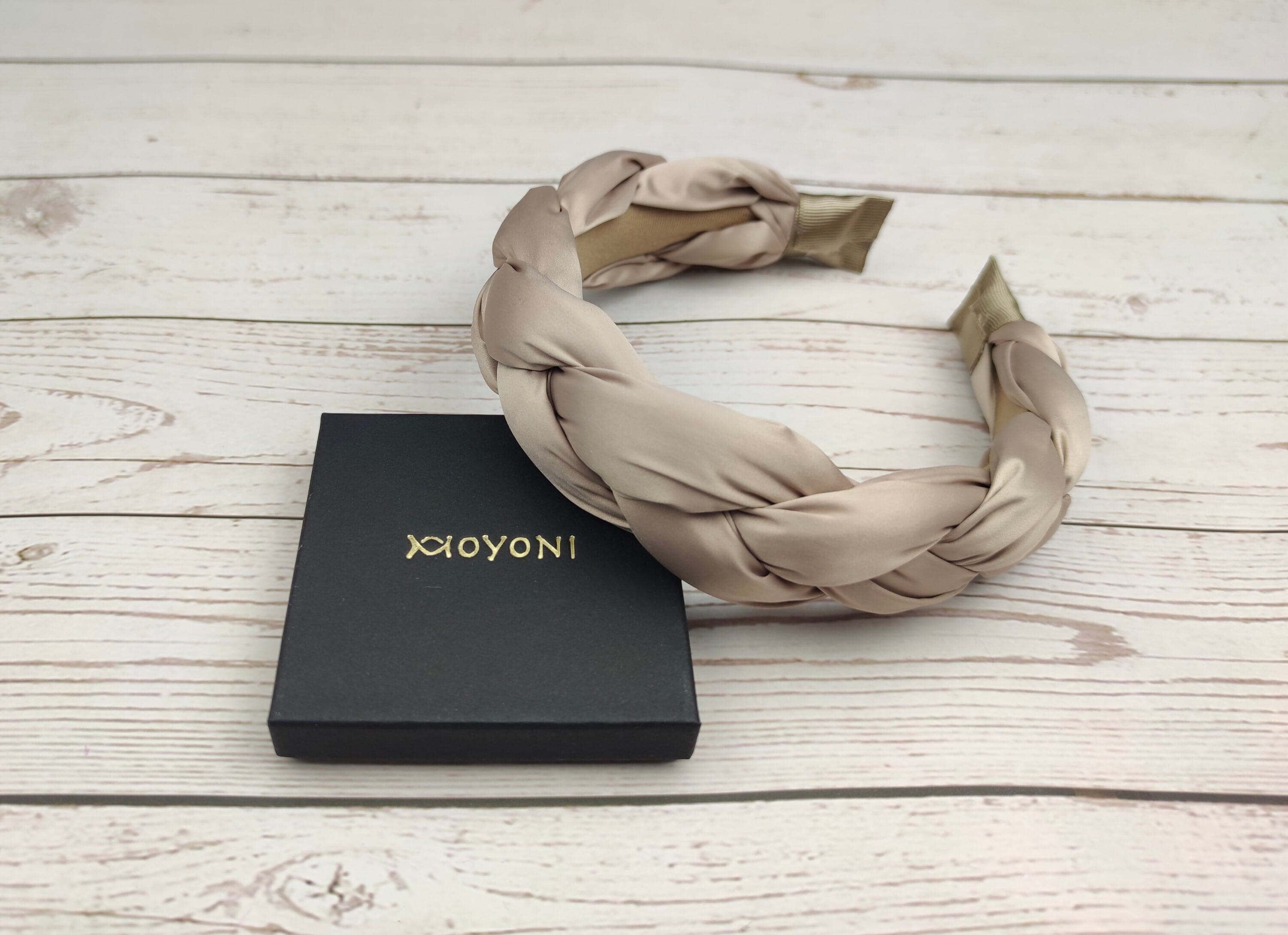 Elevate her summer style with this beautiful beige satin braided headband.
