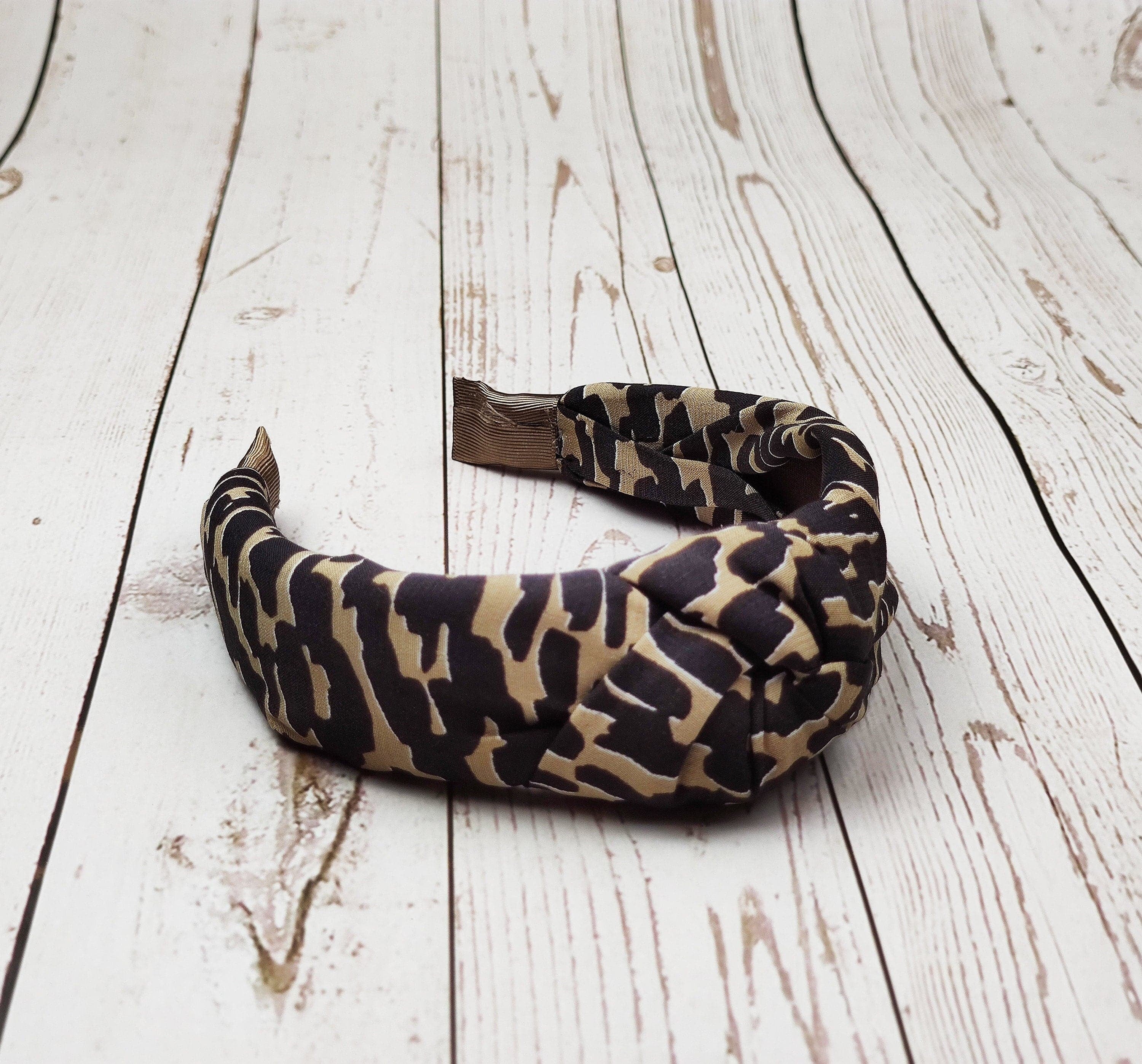 Elevate your hair game with this padded leopard pattern headband, a versatile and trendy accessory for any hair type.