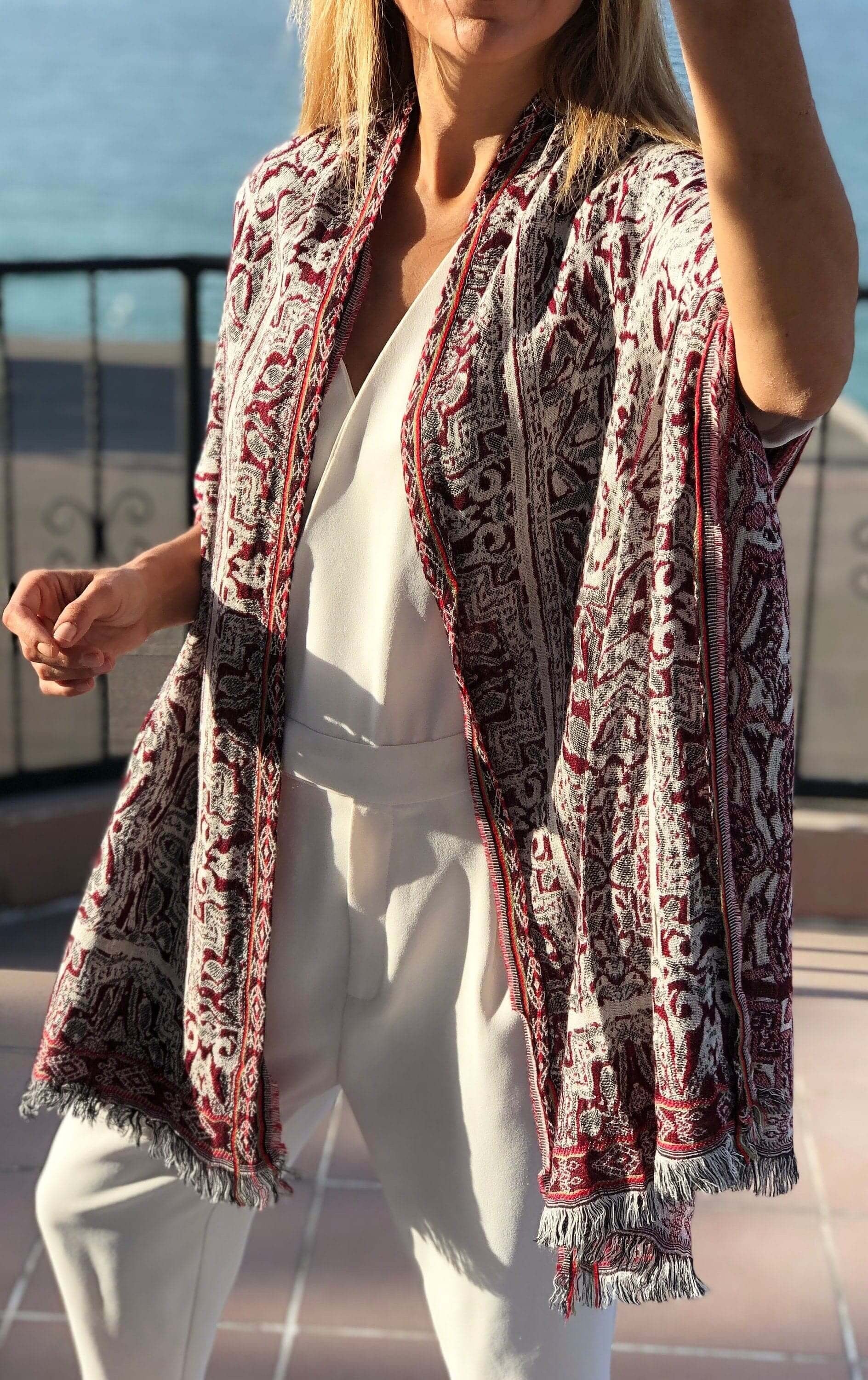 Make a statement with this Red Black White Cotton Scarf, featuring an eye-catching ethnic pattern.