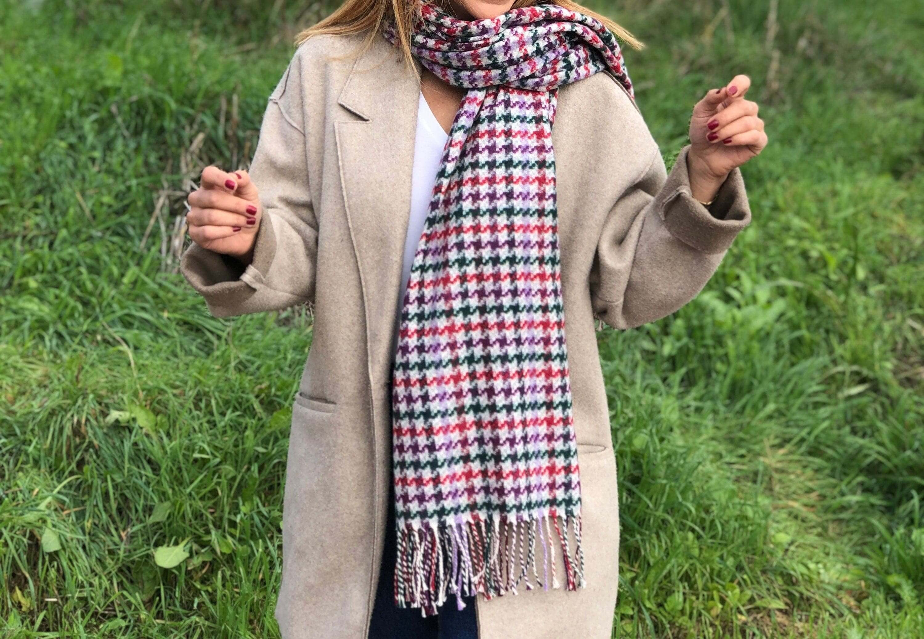 Stay cozy and on-trend with this stylish Scarf in purple, white, and green