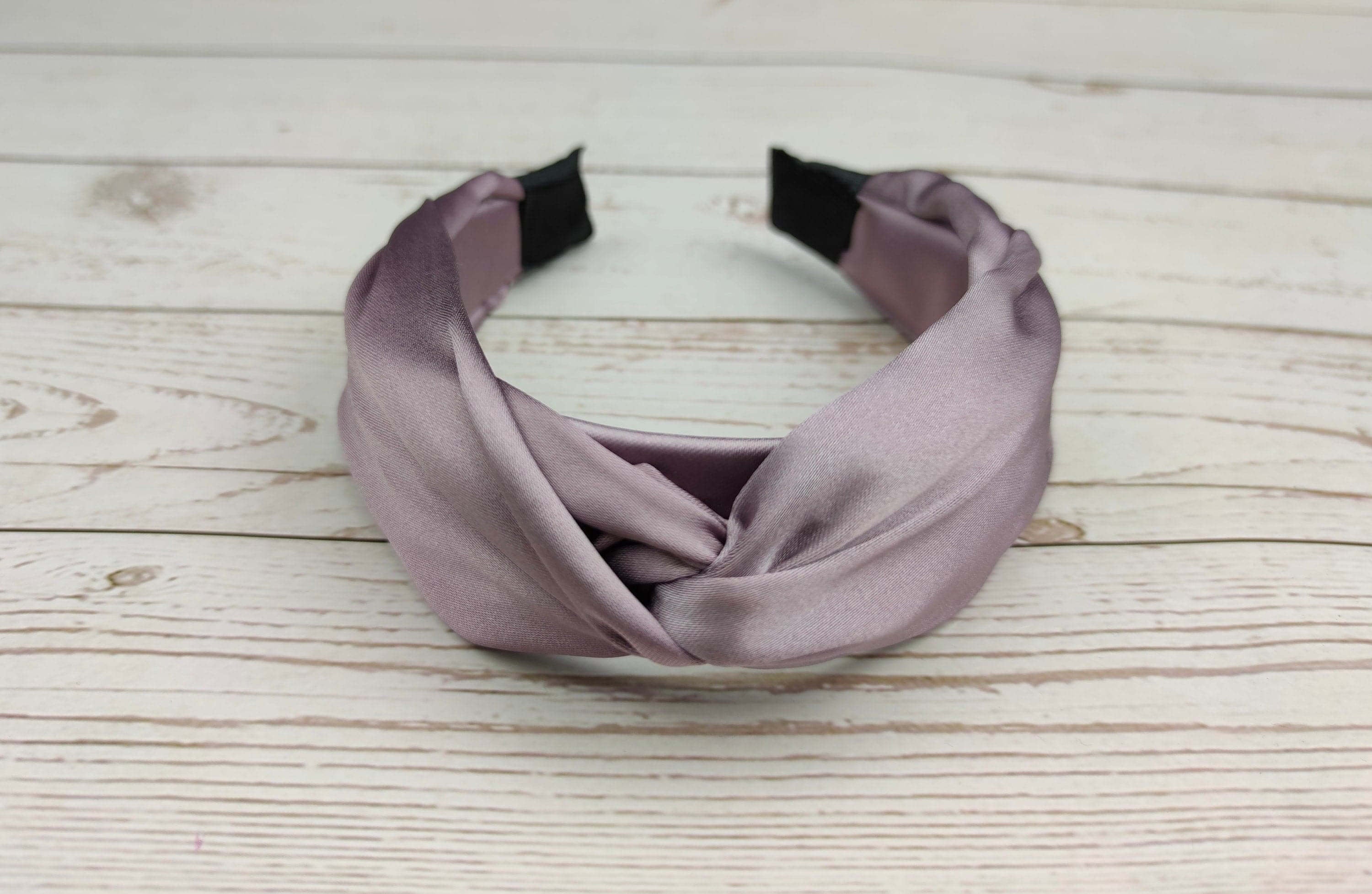Elegant Lilac Satin Headband: This knotted headband is perfect for adding a touch of sophistication to any outfit.
