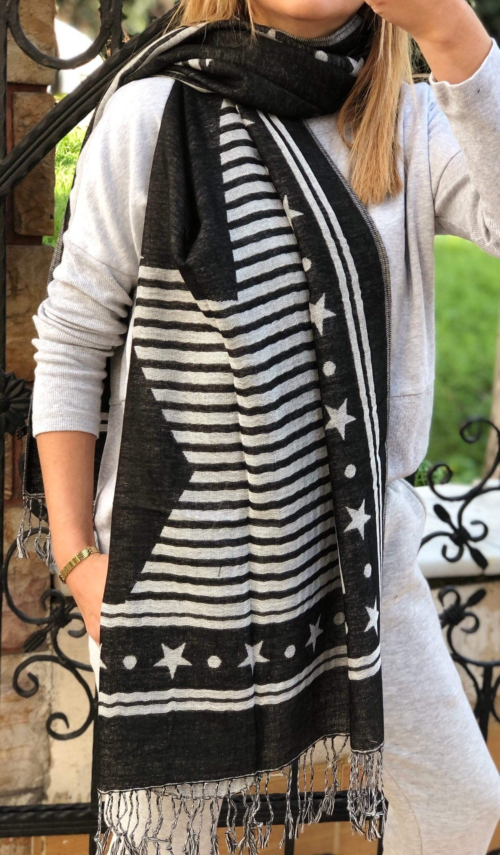 Elegant Black & White Acrylic Scarf: An elegant and timeless black and white acrylic scarf, perfect for dressing up any outfit. Made with soft and comfortable material, this scarf is a must-have accessory for any fashion-forward woman.