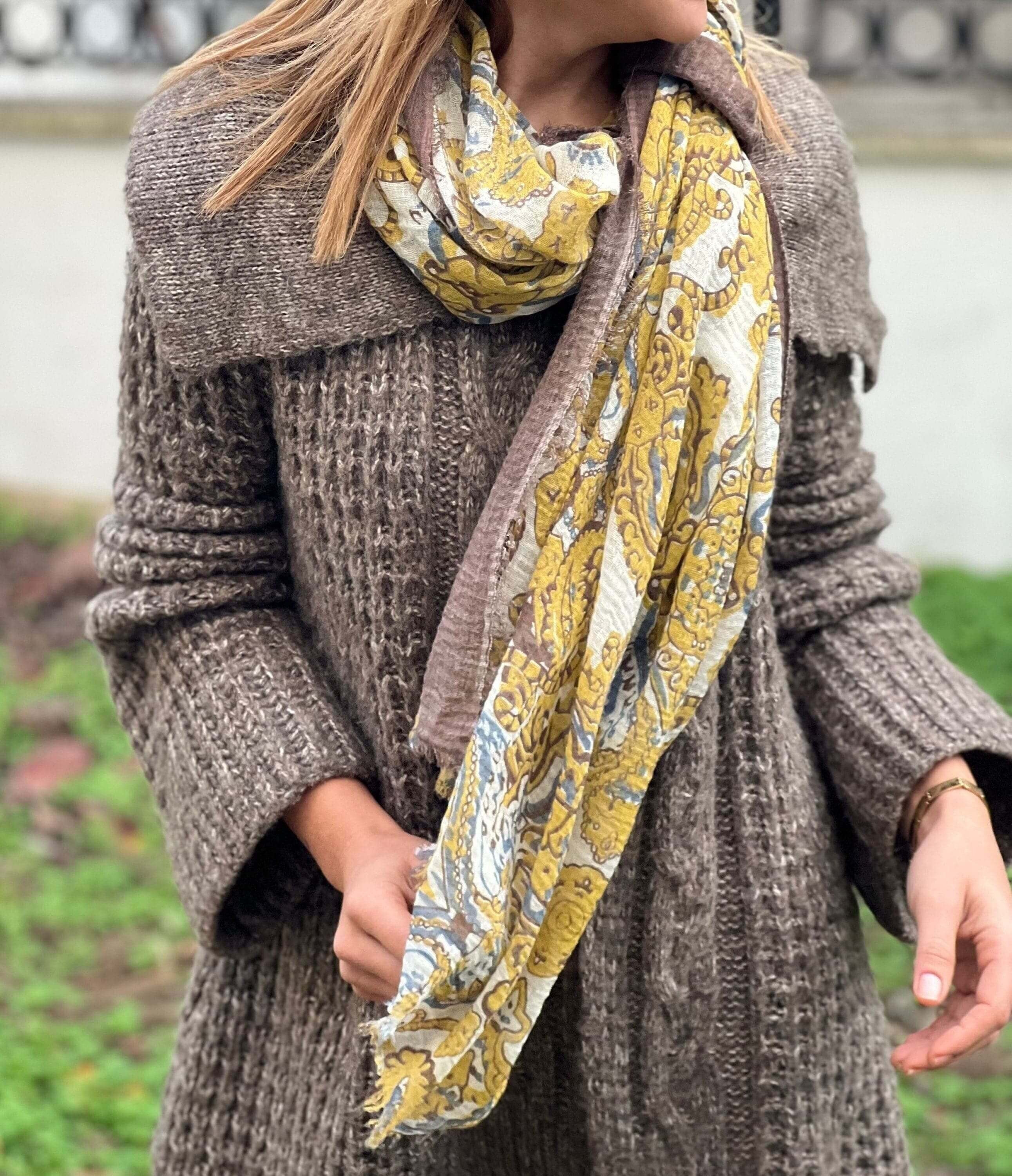 Stay cozy and stylish with this beautiful yellow and white ethnic pattern cotton scarf, perfect for spring and autumn.
