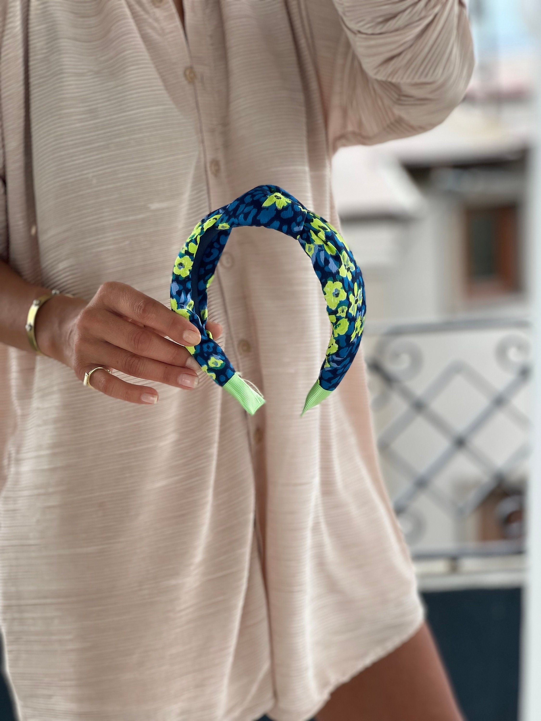 A stylish Hairband with a unique knot design that adds a touch of elegance to any outfit.