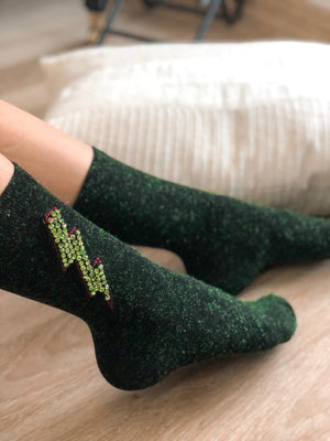Make a bold statement with these one-of-a-kind electric effect green handmade socks, featuring light green crystals and a trendy design.