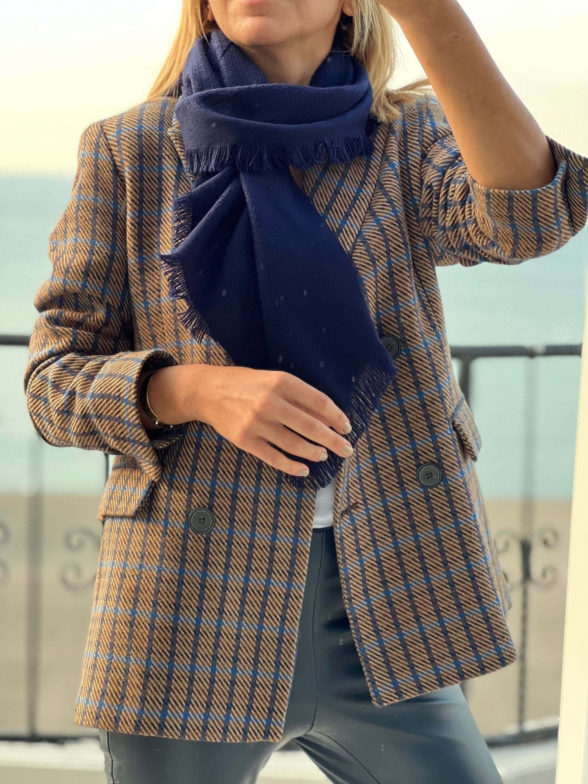 Stay stylish and warm with this navy blue cotton wool blend scarf. A perfect gift for her, this solid scarf is soft and comfortable.