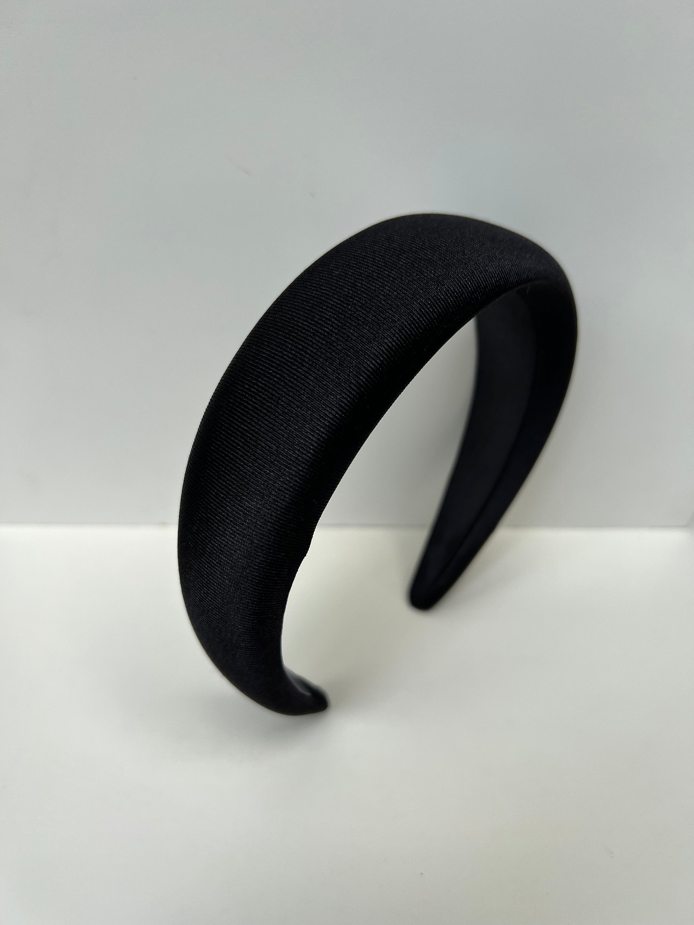 Add some sophistication to your hair with these black satin headbands, perfect for everyday elegance or special occasions.