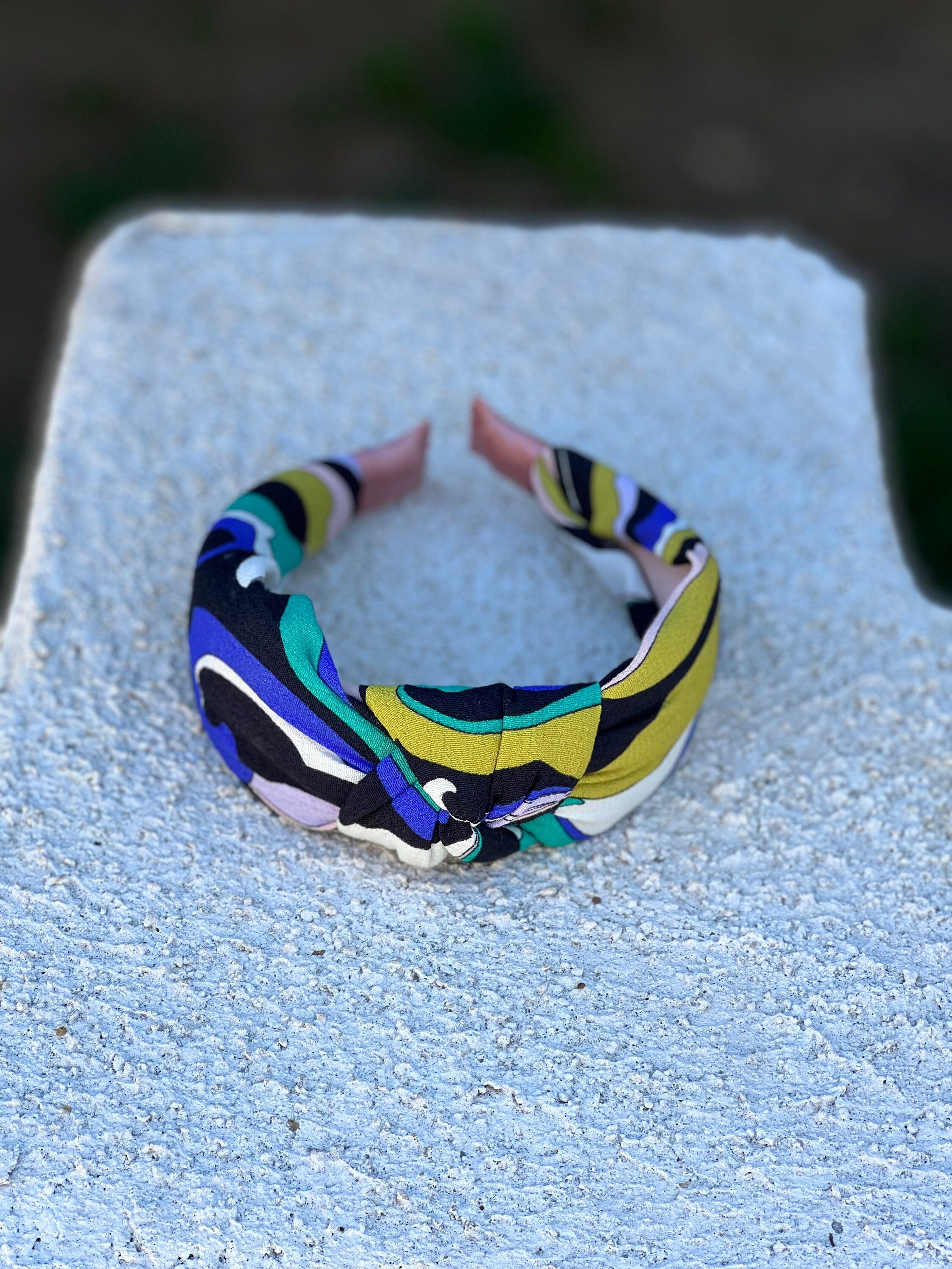 Make a fashion statement with our All-Season Headband. This hairband features a unique black, white, blue, and green color combination, perfect for any outfit.
