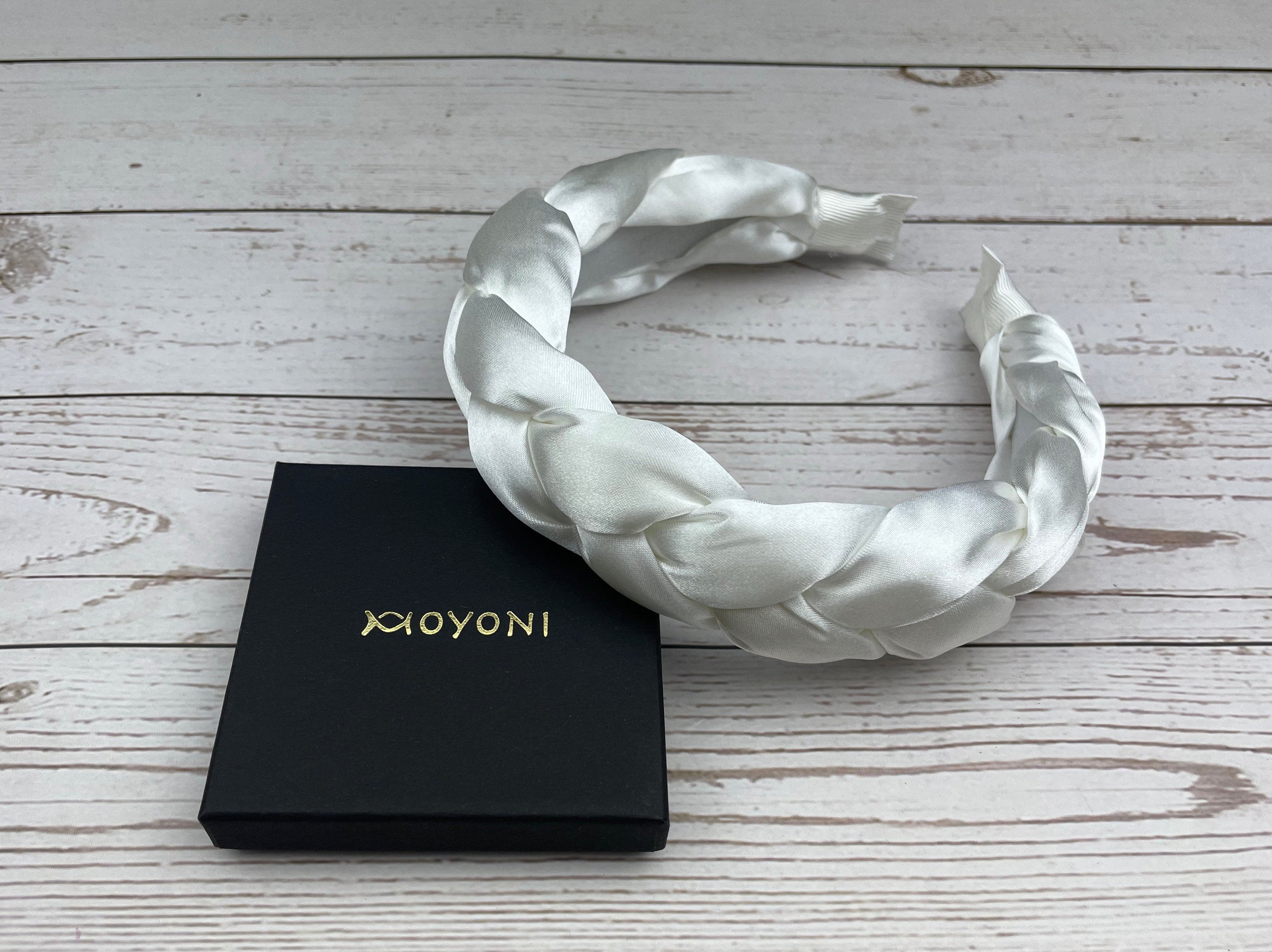Make a statement at your next celebration with this beautifully designed Snow White Padded Satin Knitted Headband. The perfect accessory for stylish women who love to accessorize.