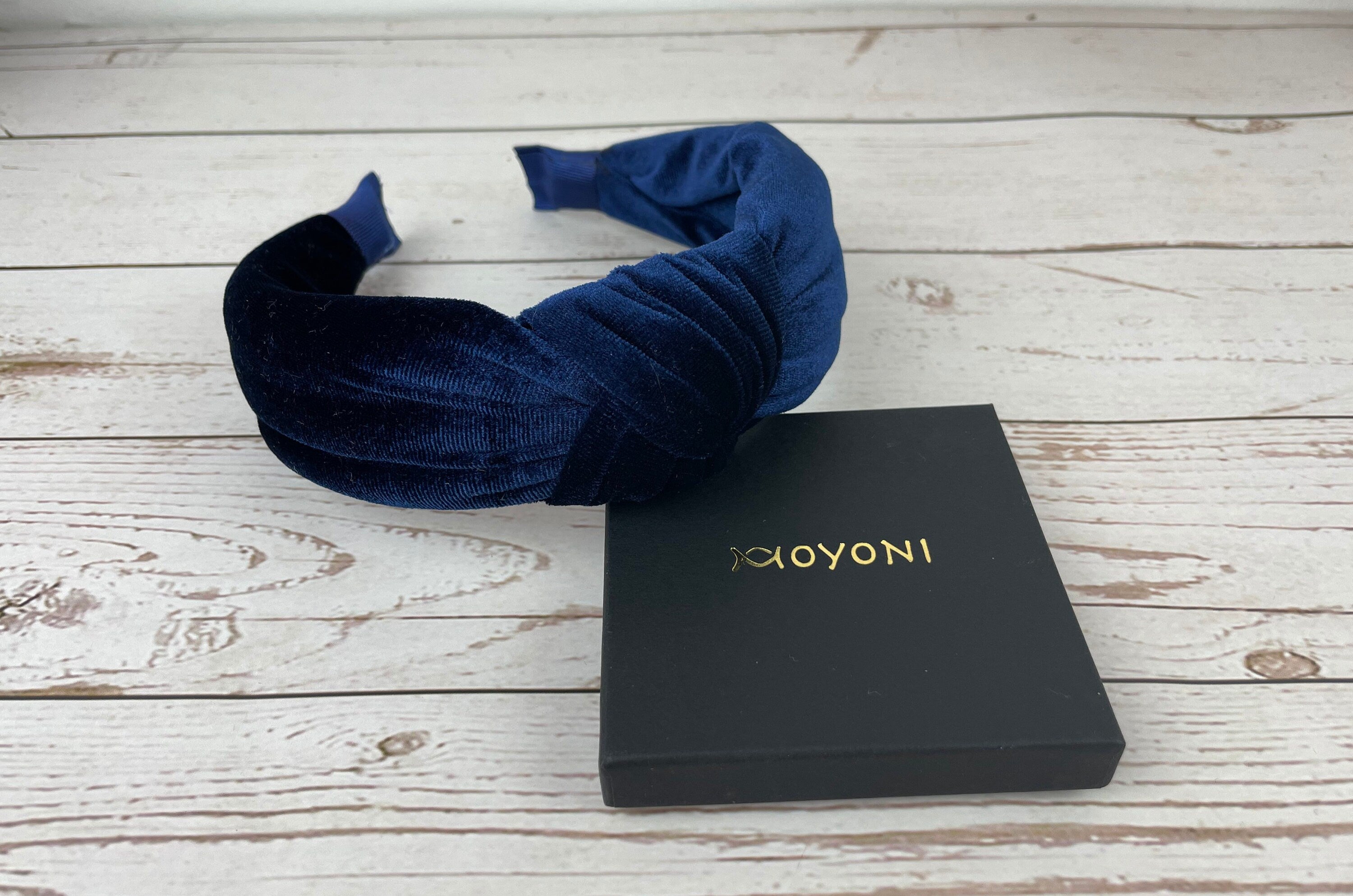 Add a touch of sophistication to your look with this Navy Blue Headband - perfect for both casual and formal occasions.