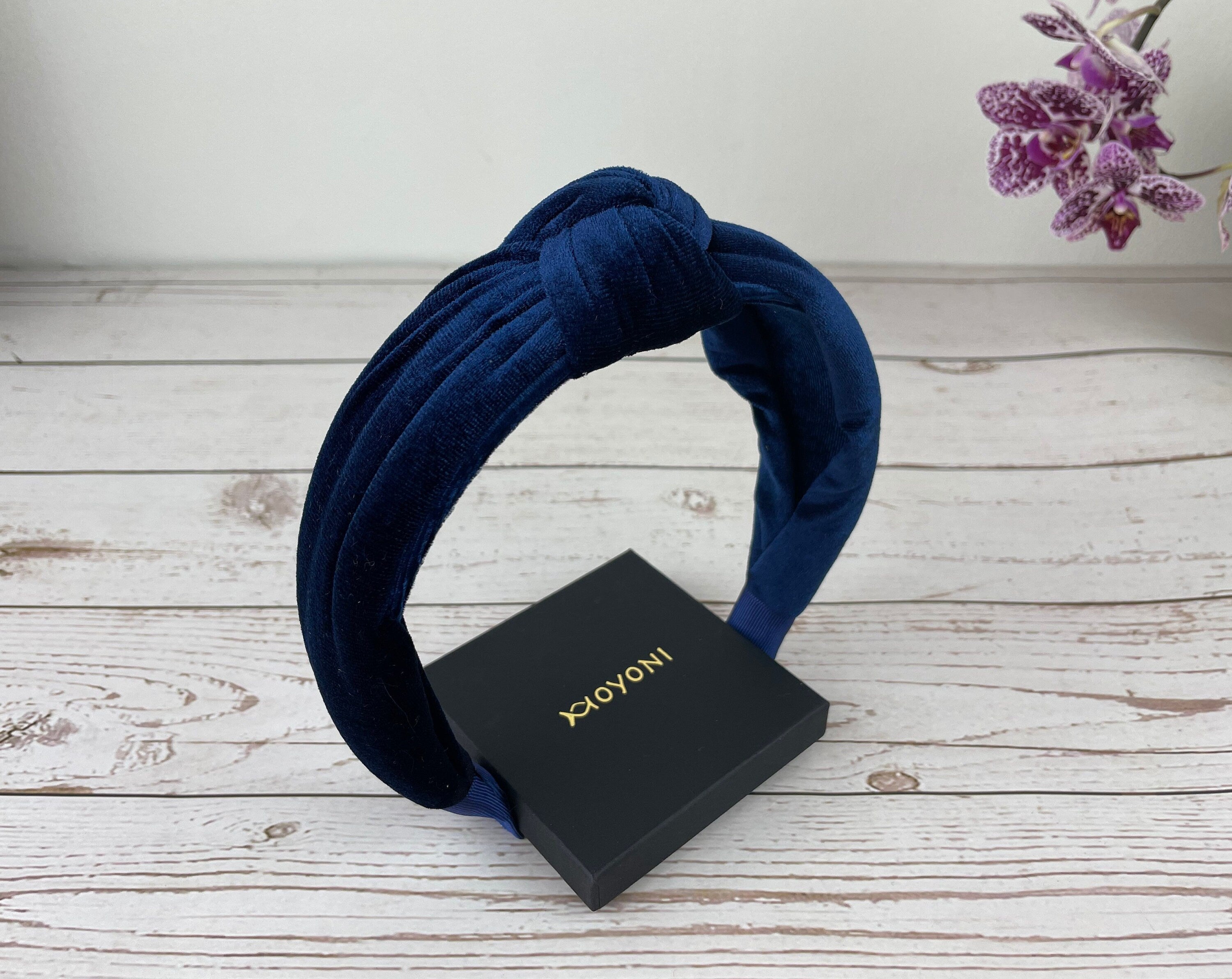Experience the ultimate in luxury with this exquisite Navy Blue Knotted Velvet Headband, crafted from premium materials for a truly indulgent feel.