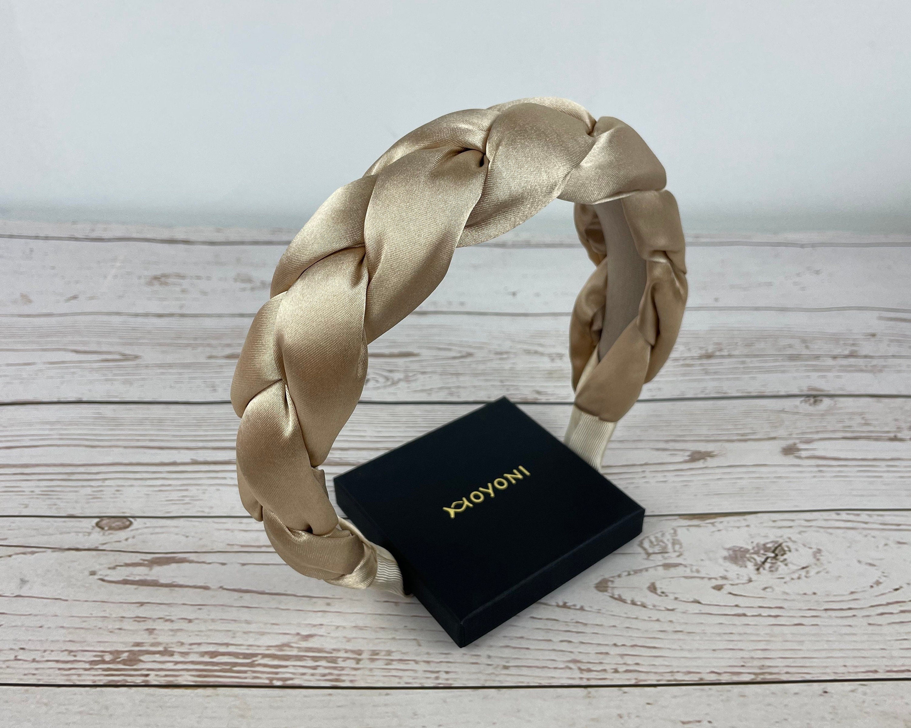 Luxurious and chic, this stylish dark beige satin braided headband is a fashionable statement piece