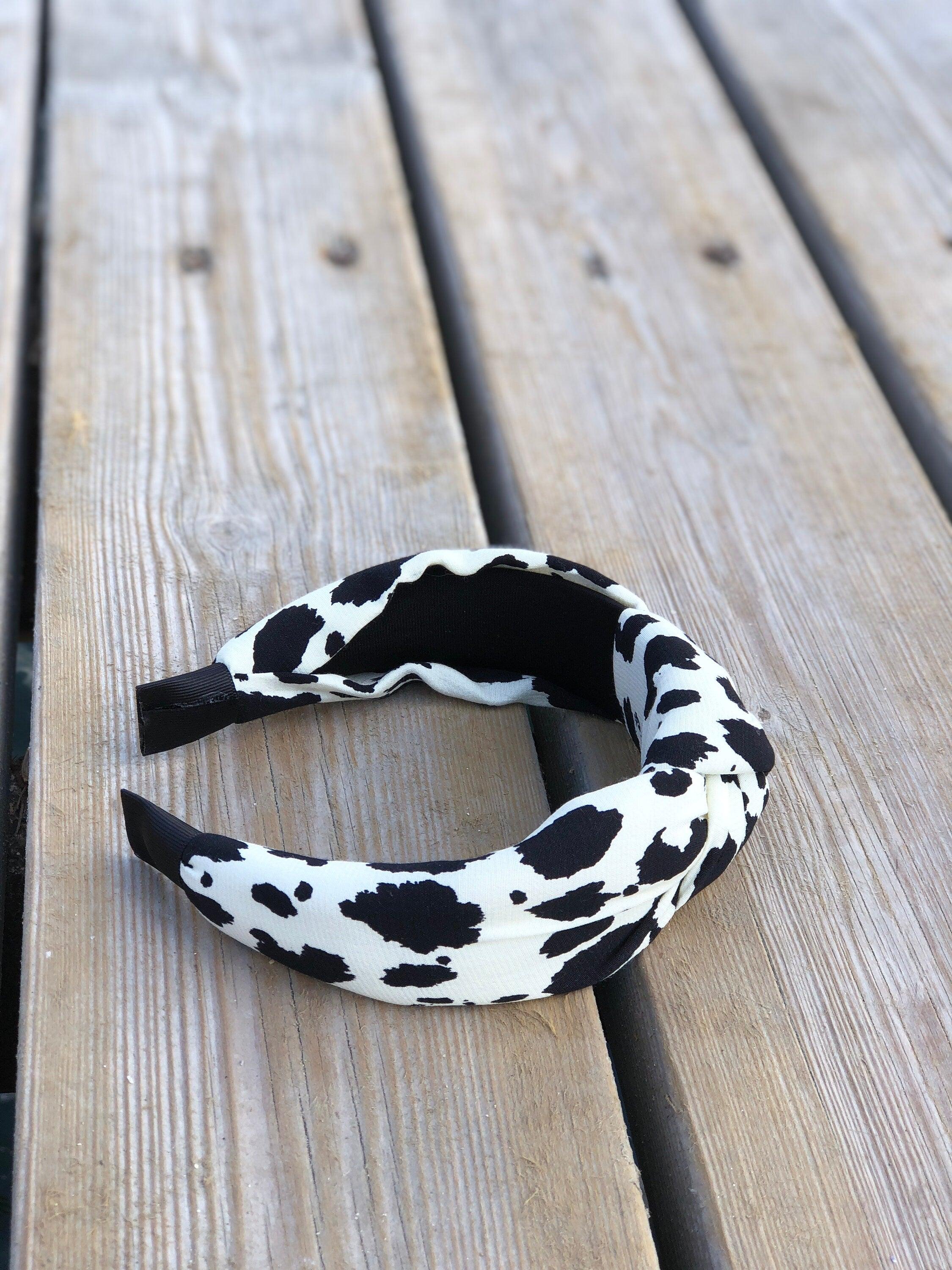 Delicate White Leopard Headband - Stylish African-Inspired Spotted Cotton Headband with Wide Design and Black Bow Accent available at Moyoni Design